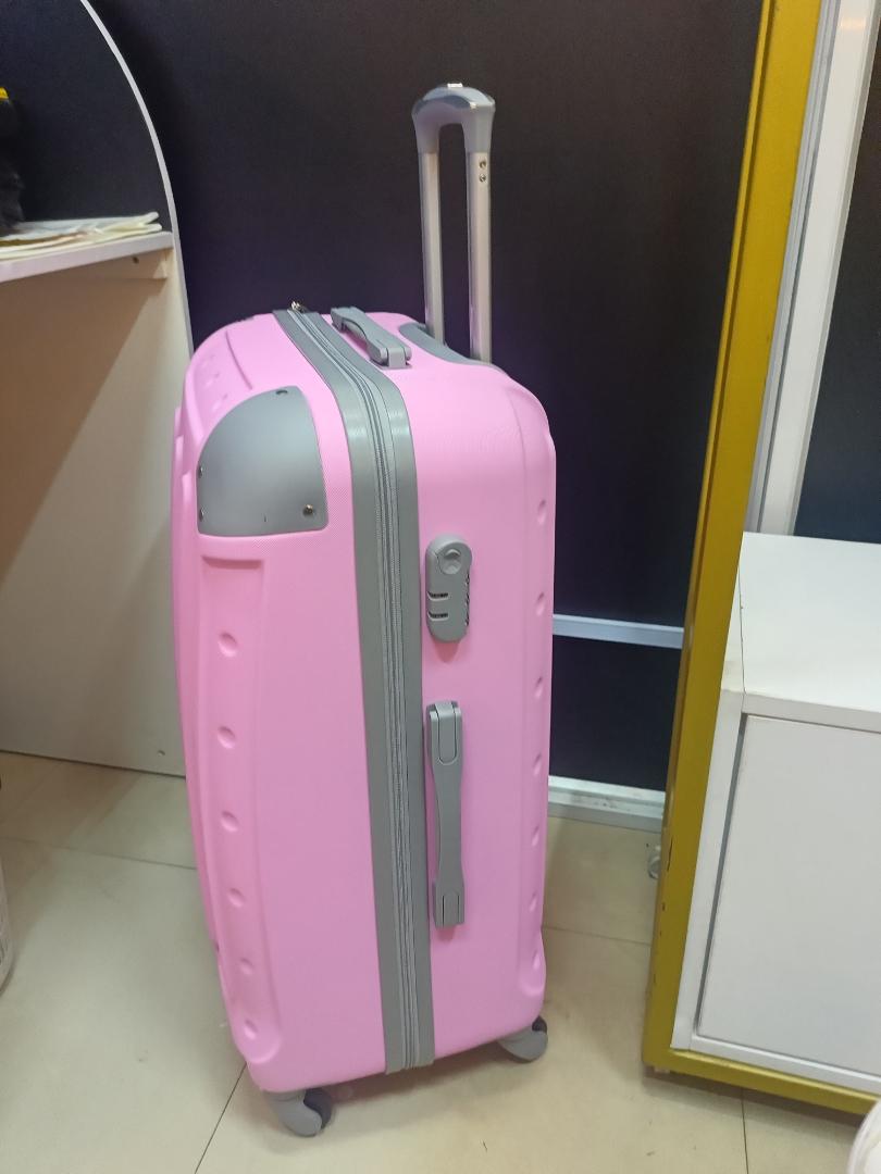 small pink  fibre suitcase