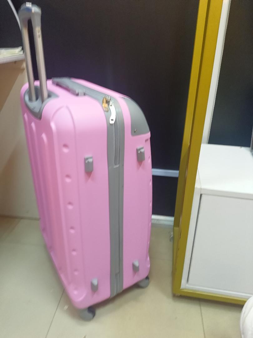 small pink  fibre suitcase