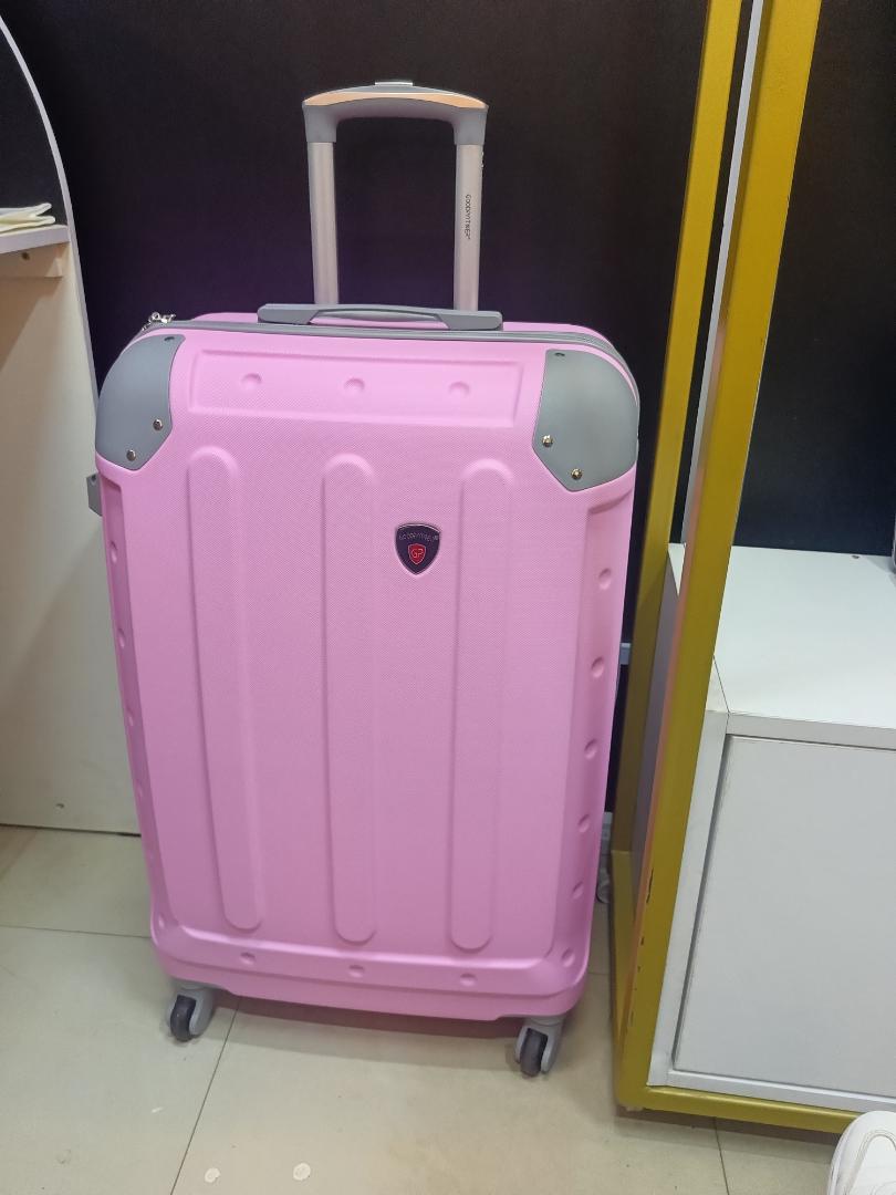 small pink  fibre suitcase