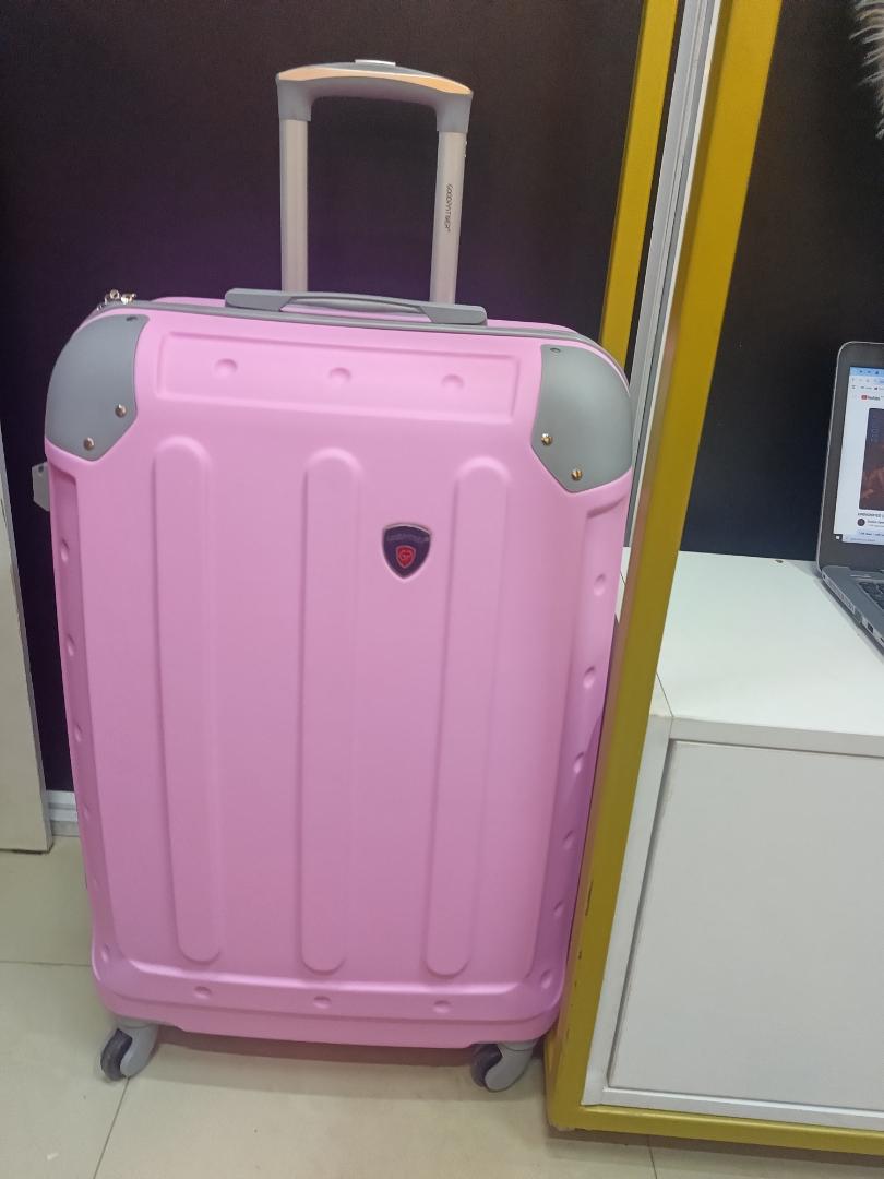 small pink  fibre suitcase