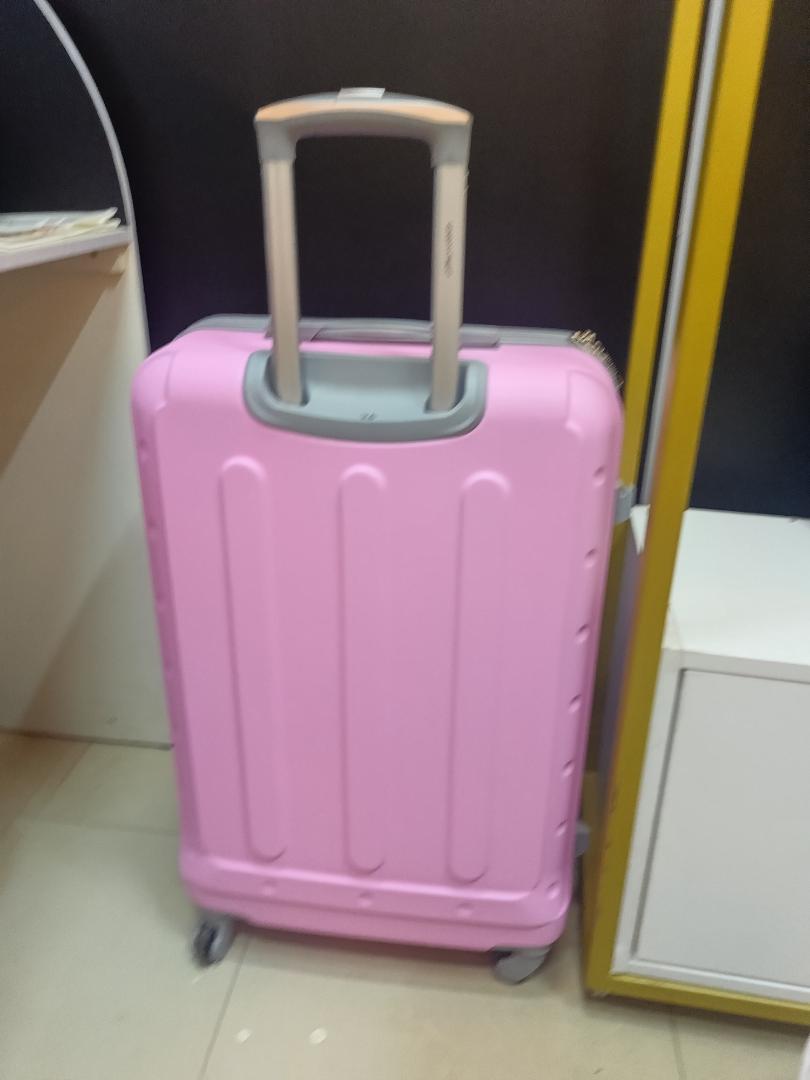 small pink  fibre suitcase