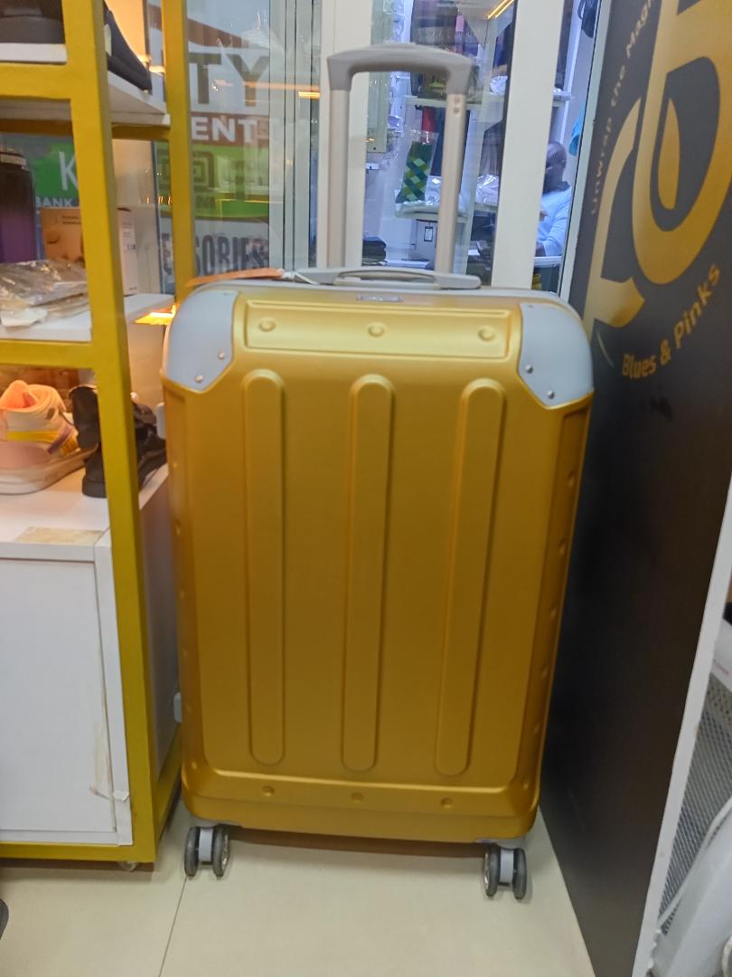 small golden fibre suitcase sold as single