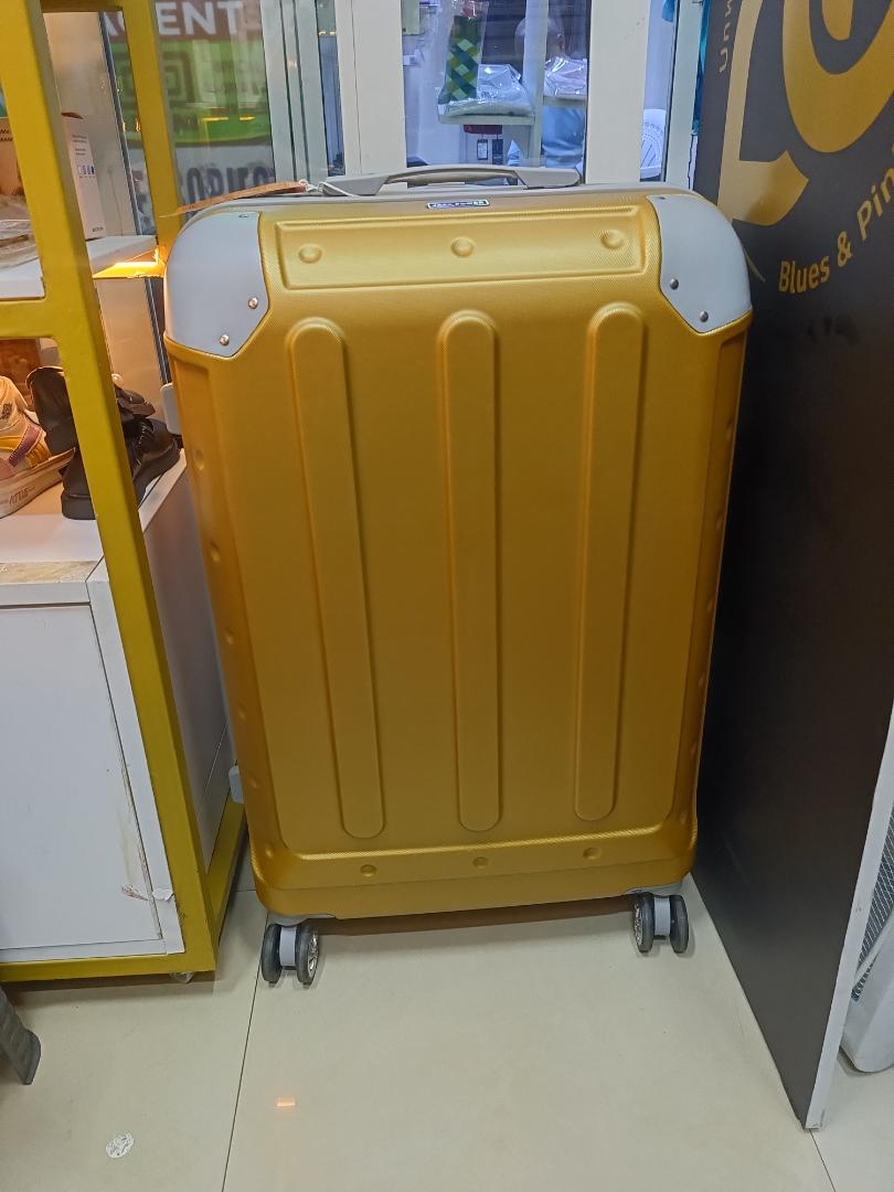 small golden fibre suitcase sold as single