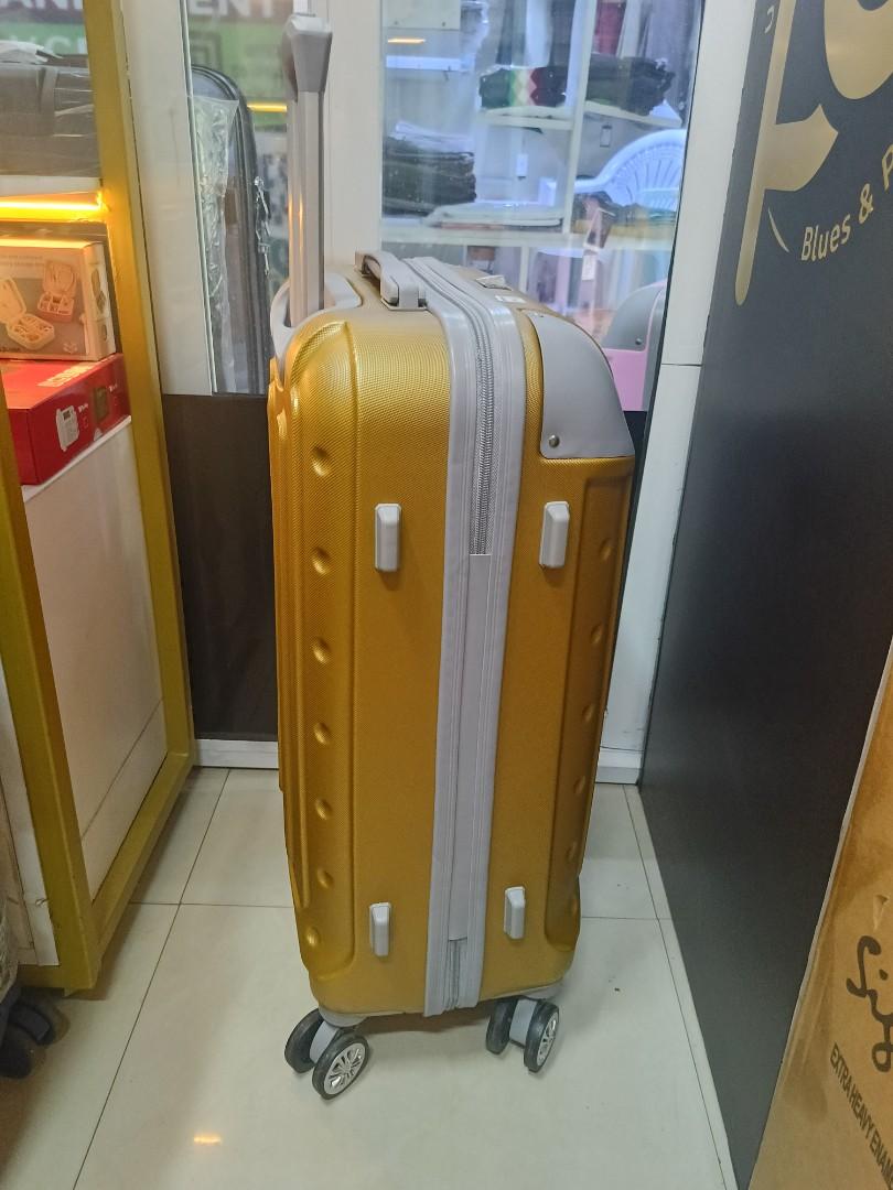 small gokden fibre suitcase with grey corners and with measure of H 47, W 33, L 23