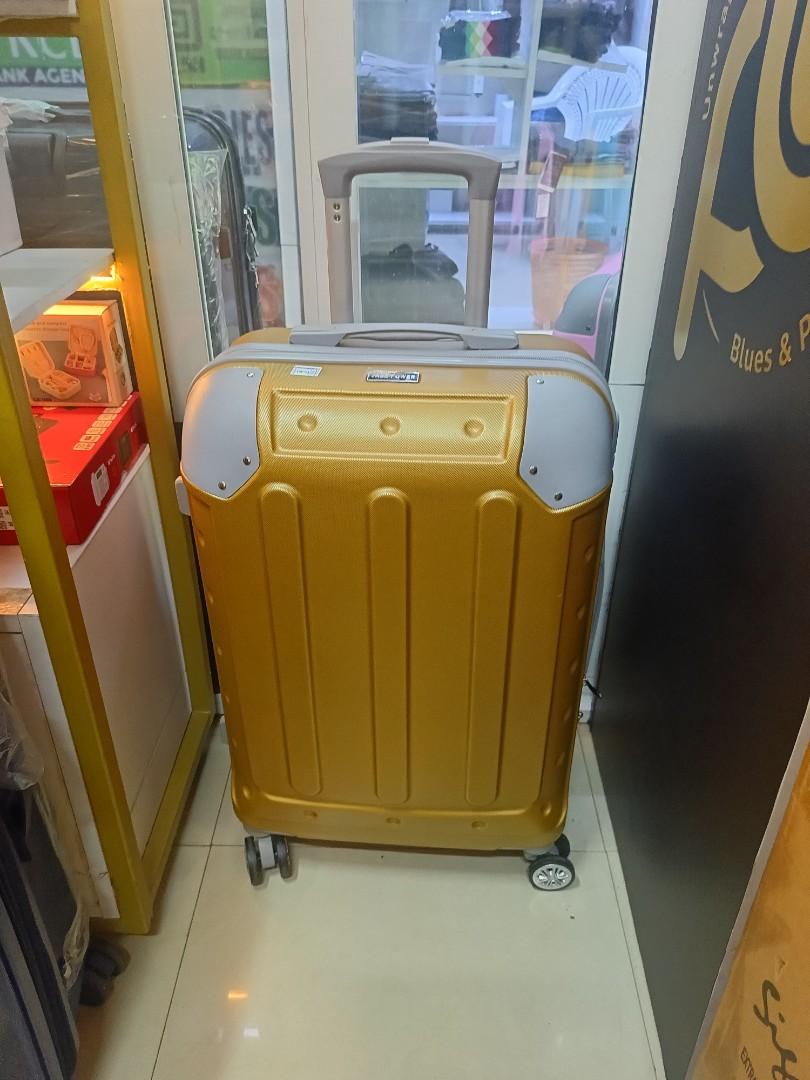 small gokden fibre suitcase with grey corners and with measure of H 47, W 33, L 23