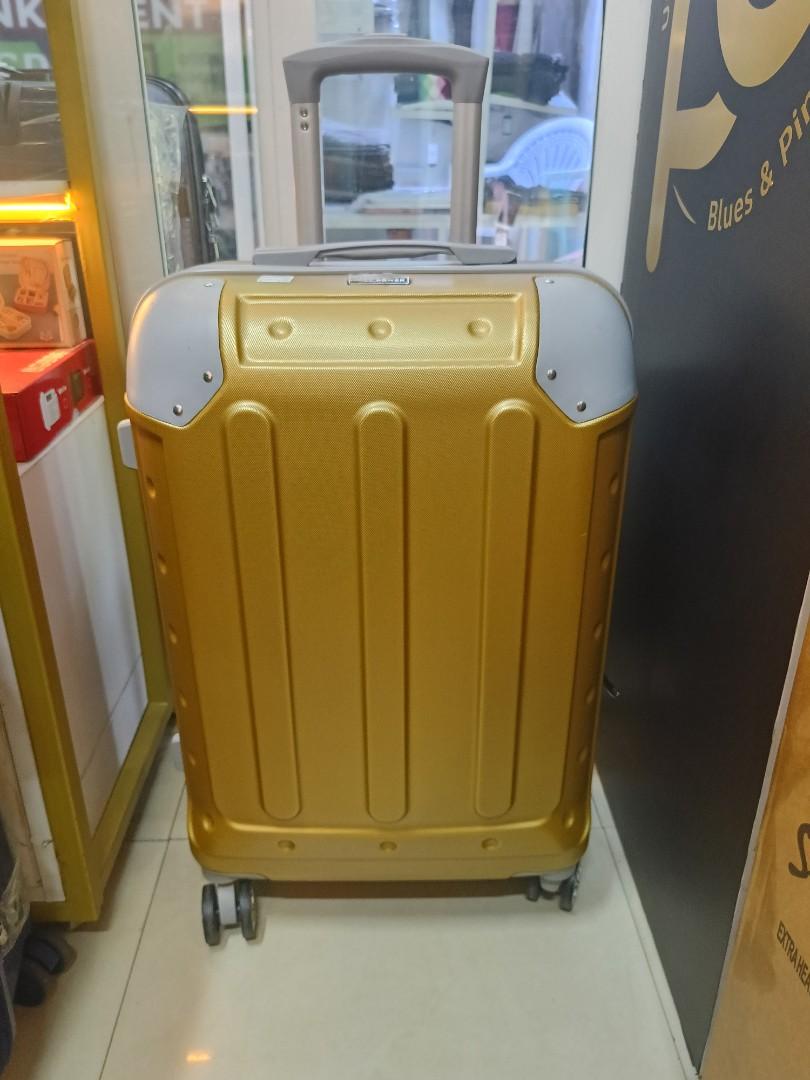 small gokden fibre suitcase with grey corners and with measure of H 47, W 33, L 23