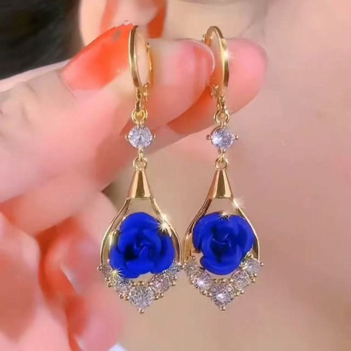 Red rhinestone rose earrings for women, exuding a sophisticated and elegant style. These delicate, dangling earrings are versatile and easy to match.