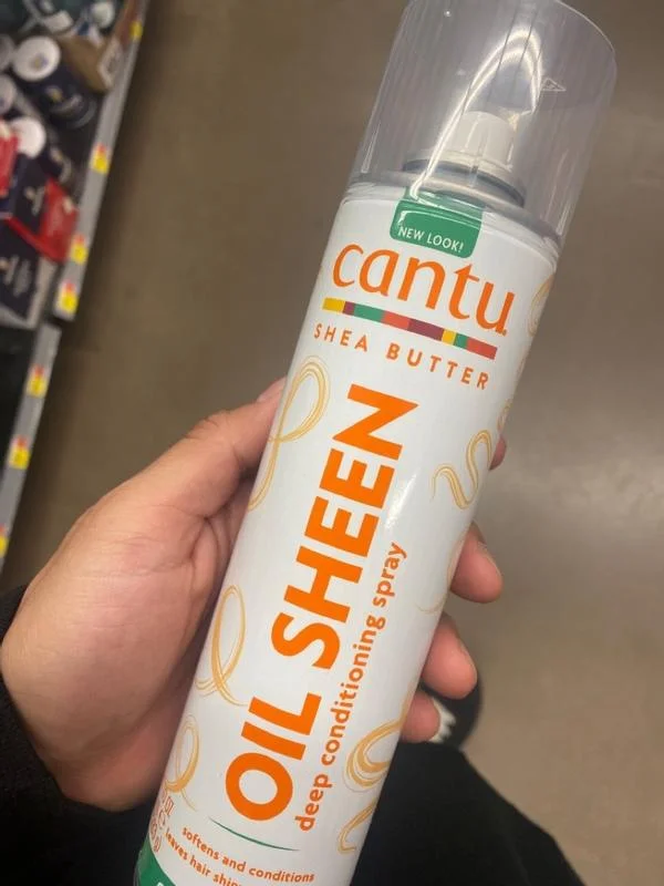 Cantu Shea Butter Oil Sheen Deep Conditioning Spray is a hair product designed to moisturize, soften, and add shine to hair. It's formulated with shea butter and other oils to nourish and protect hair