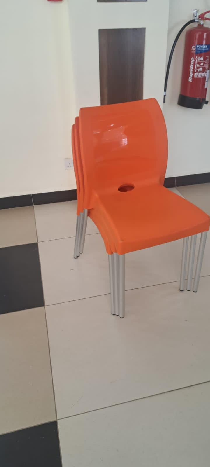Armless plastic chairs with metal tubing stands
