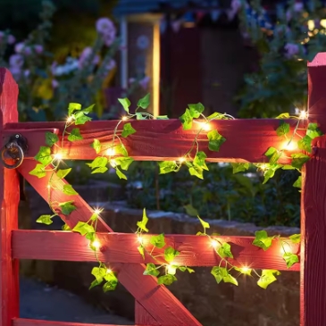 Flower and green leaf string lights, artificial vine fairy lights, battery-powered Christmas tree garland lights, used for weeding and home decoration.
