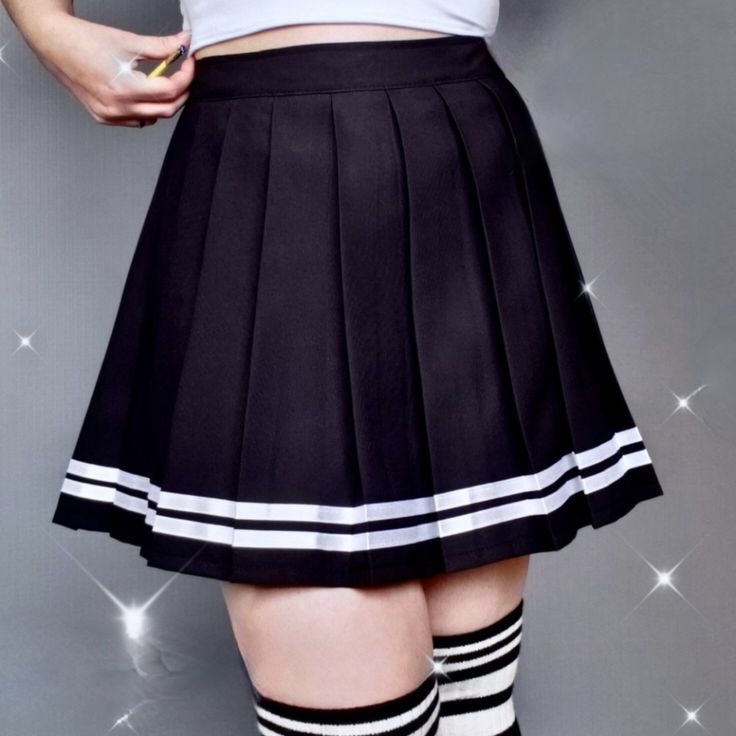 Black tennis skirt with white stripes and inbuilt innerware