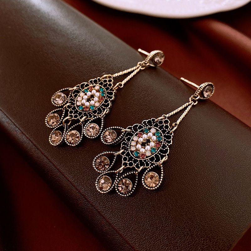 Vintage high-end silver needle ethnic style diamond inlaid flower earrings with exaggerated European and American temperament earrings pendant light luxury niche earrings