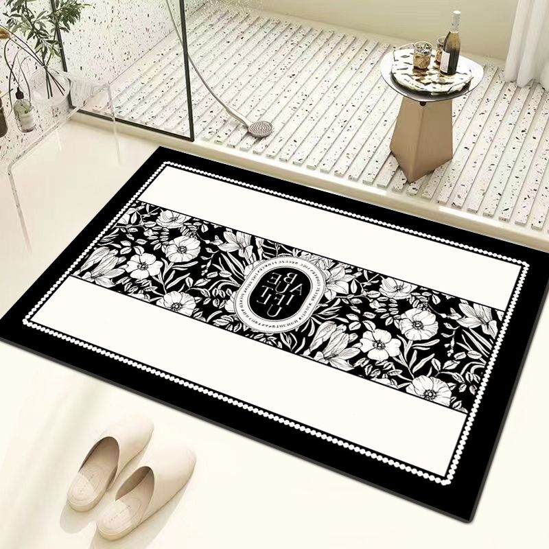 Elegant monochrome entrance mat with ornate central pattern. Made for absorbing moisture and dirt. Ideal for enhancing home decor while keeping floors clean. Suitable for various interior styles, prov
