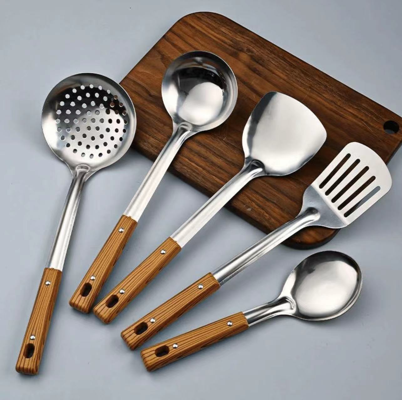 Stainless Steel Kitchen Utensil 5 Set with Wooden Handles. Includes slotted spoon, spatula, ladle, skimmer, and strainer. Durable, rust - resistant,Does not include cutting board