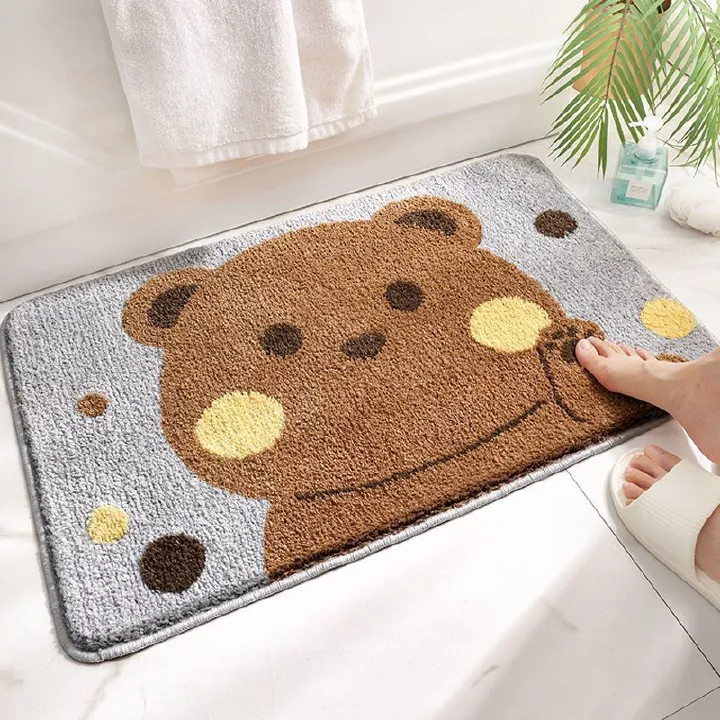 This is a cute cartoon - themed bathroom floor mat with a bear pattern. Made of anti - slip, thickened faux cashmere, it's water - absorbent and dries quickly. Ideal for bathroom entrances, it combine