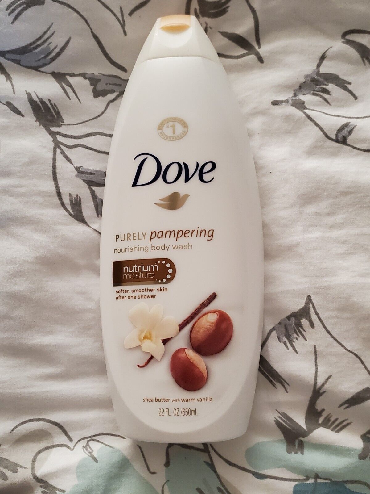 Dove Purely Pampering Shea Butter & Warm Vanilla Body Wash+Exfoliating gloves Our Pampering Body Wash is formulated with our skin-natural moisturisers that help renew your skin’s natural moisture.