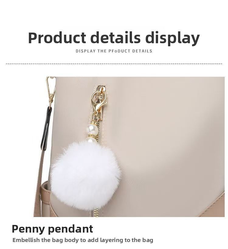 Trendy women’s backpack: white pom-pom charm, adjustable straps. Spacious, stylish & versatile—perfect for Kenyan young ladies’ daily outings/work.