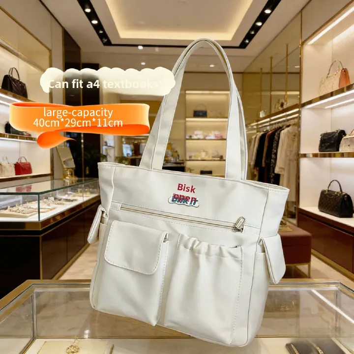 Trendy large-capacity white tote bag: "DISK IT" print, multi-pockets. Spacious, lightweight & practical—perfect for Kenyan young ladies’ daily outings/shopping.