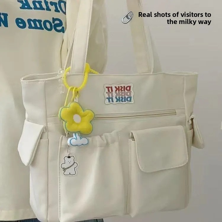 Trendy large-capacity white tote bag: "DISK IT" print, multi-pockets. Spacious, lightweight & practical—perfect for Kenyan young ladies’ daily outings/shopping.