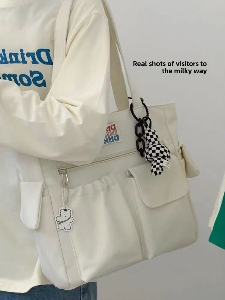 Trendy large-capacity white tote bag: "DISK IT" print, multi-pockets. Spacious, lightweight & practical—perfect for Kenyan young ladies’ daily outings/shopping.