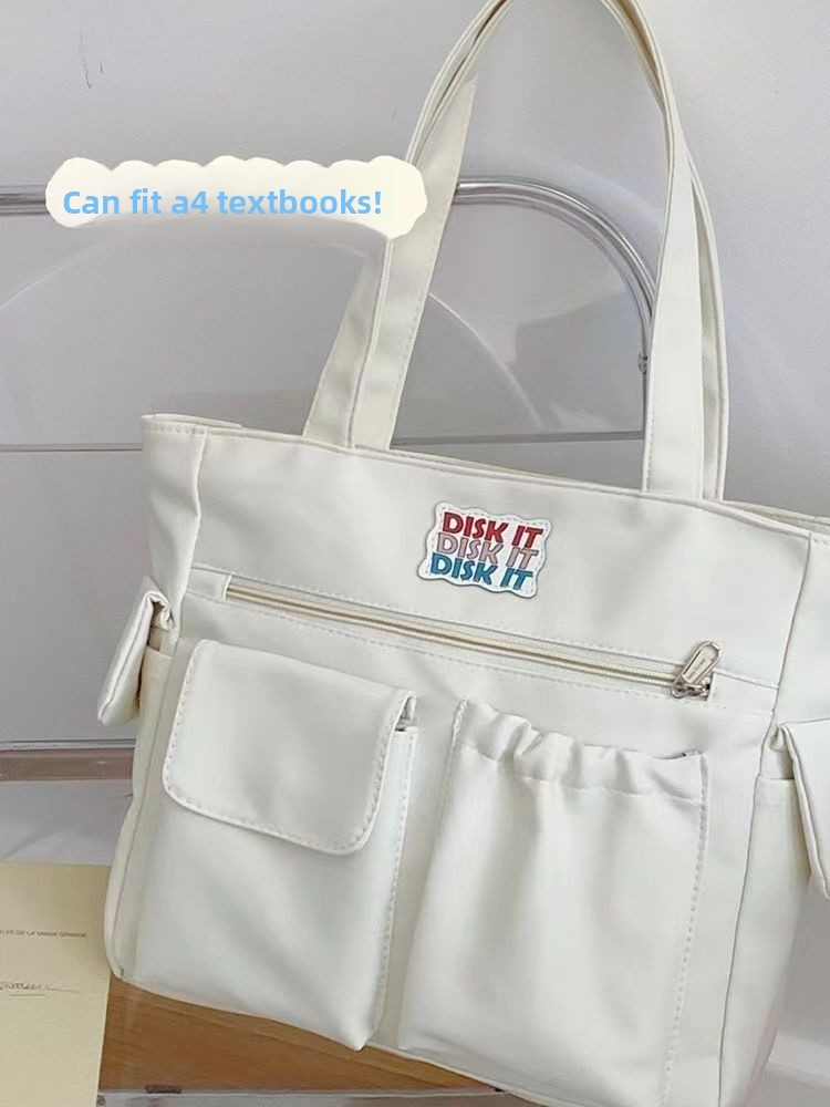 Trendy large-capacity white tote bag: "DISK IT" print, multi-pockets. Spacious, lightweight & practical—perfect for Kenyan young ladies’ daily outings/shopping.