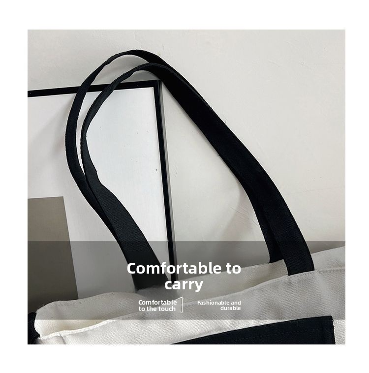 Trendy large-capacity canvas tote bag: "Korean" print, black & white design. Spacious, lightweight & versatile—perfect for Kenyan young ladies’ daily outings/shopping.