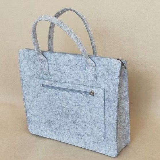 Trendy felt business tote bag: large-capacity for laptops, durable & stylish. Ideal for Kenyan young professionals’ work, commutes or business meetings.