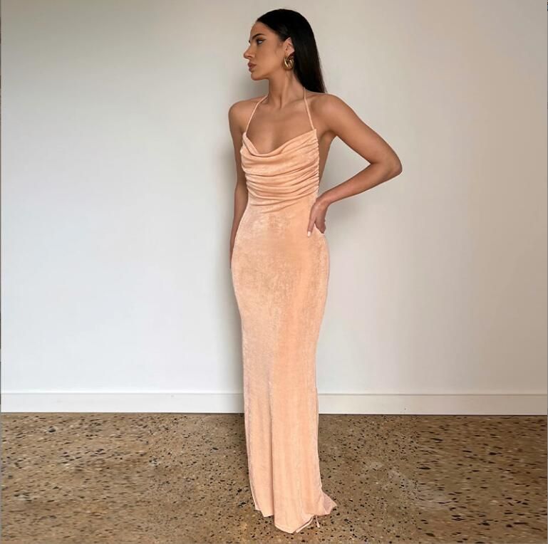 New stylish and sexy backless dress with a halter neck and tie-up details, exuding an elegant temperament. This long dress is suitable for parties and evening banquets in the summer of 2025.