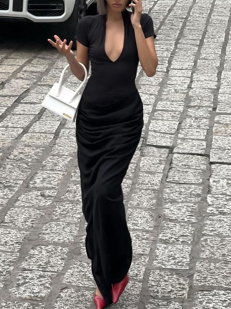 New elegant and sexy long dress for guests at evening banquets in the summer of 2025. It features a deep V-neck, short sleeves, a solid color, a form-fitting silhouette and pleats.