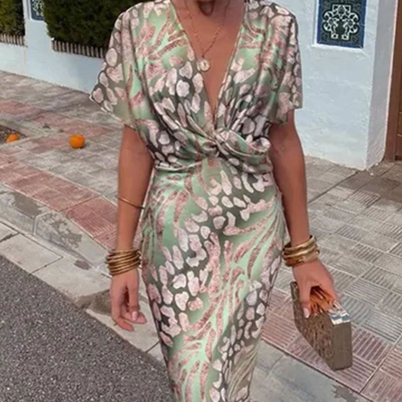 New women's dresses in summer are fashionable and elegant, printed with short sleeves and V-neck kinks, and the waist long dresses are suitable for daily leisure office commuting.
