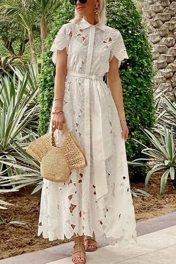 New women's dresses in summer are fashionable and elegant. Lace openwork short-sleeved lapels and single-breasted cardigans are long dresses suitable for daily leisure and holiday commuting.