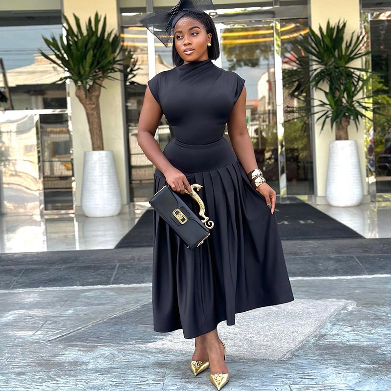 Summer new women's two-piece fashion solid color sleeveless turtleneck top with pleated waist and large skirt long skirt suit is suitable for leisure parties, banquets and office commuting.
