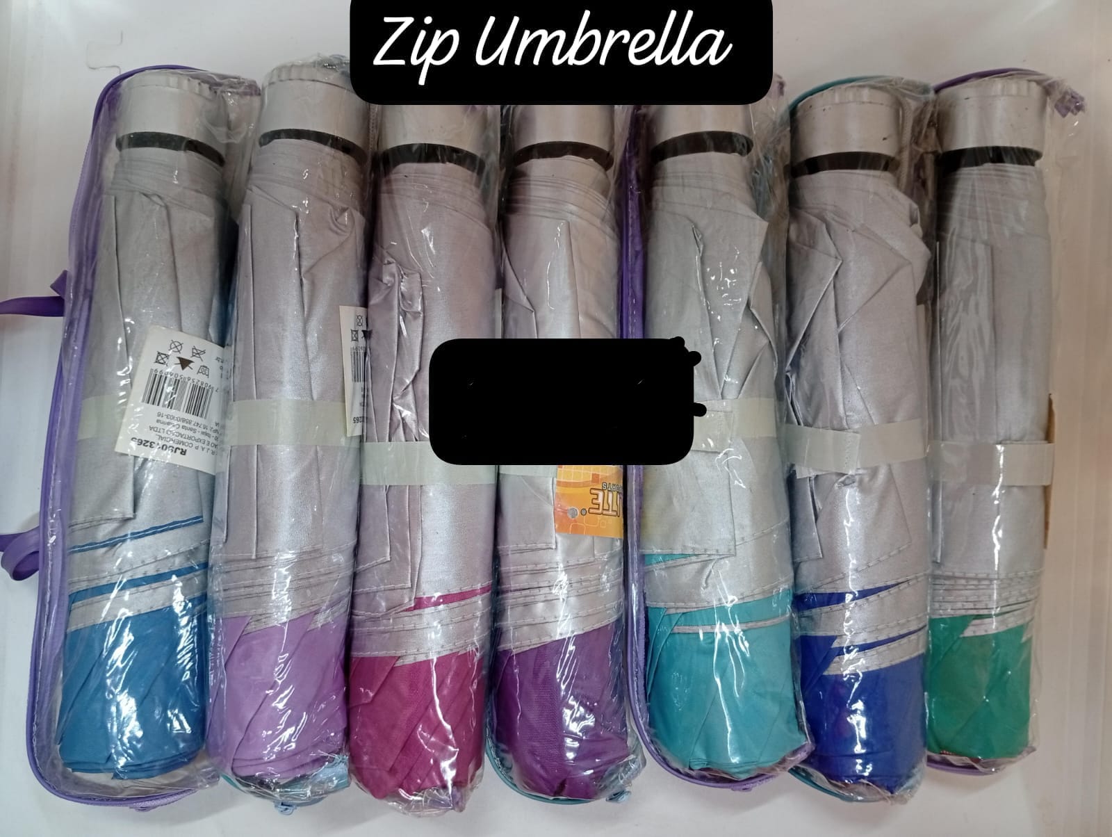 assorted compact, portable umbrellas,designed to be small enough to fit in a bag or briefcase when folded. 
Can be used in both rain and sun as they are often made from UV-resistant material.
