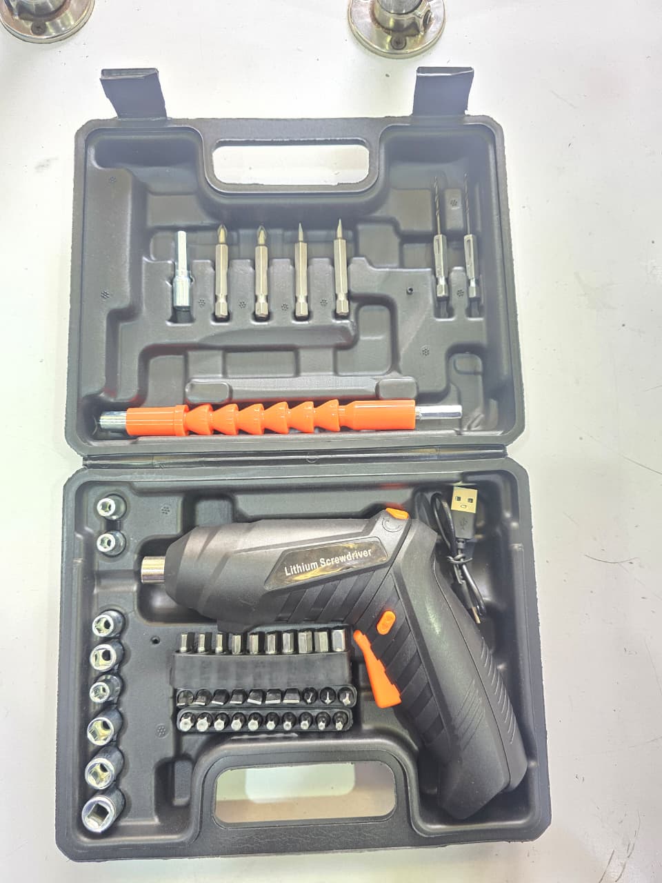 48pcs rechargeable electric screwdriver kit with various bits. 
It is a cordless tool powered by a built-in rechargeable lithium-ion (Li-ion) battery. 
The kit typically includes a range of interc