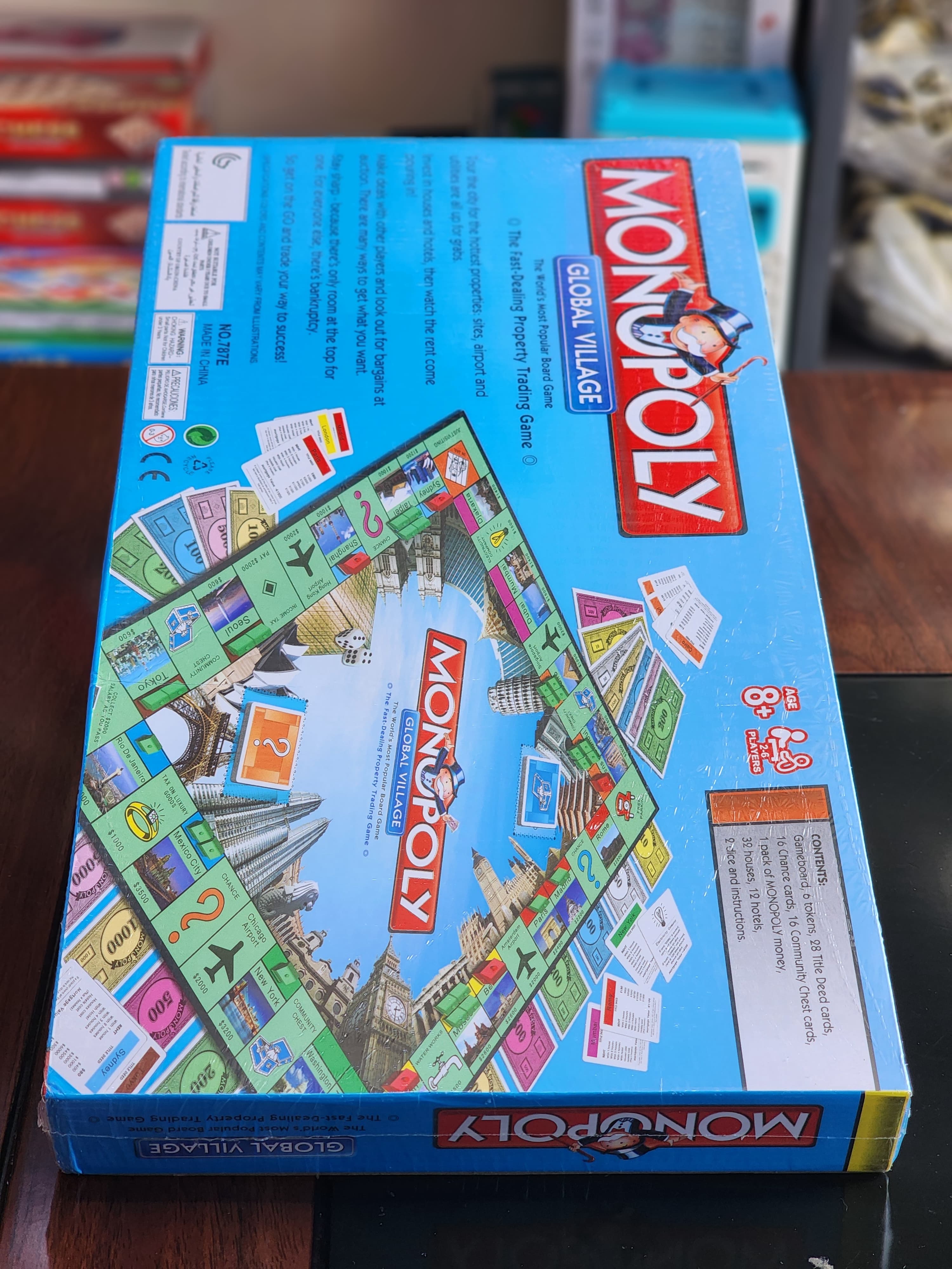 Monopoly Global Village Board Toys & Games Game paper board (foldable) 6 Token 28 Title Deed Cards 16 Chance cards 16 community chest Cards 1 pack of Monopoly money 32 houses 12 hotels large size