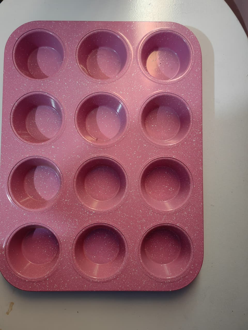 GOODCOOK MEGAGRIP 12-CUP MUFFIN PAN WITH SILICONE GRIP HANDLES PERFECT FOR CUPCAKES DURABLE HEAVY-GAUGE STEEL CONSTRUCTION SCRATCH-RESISTANT NONSTICK COATING PINK