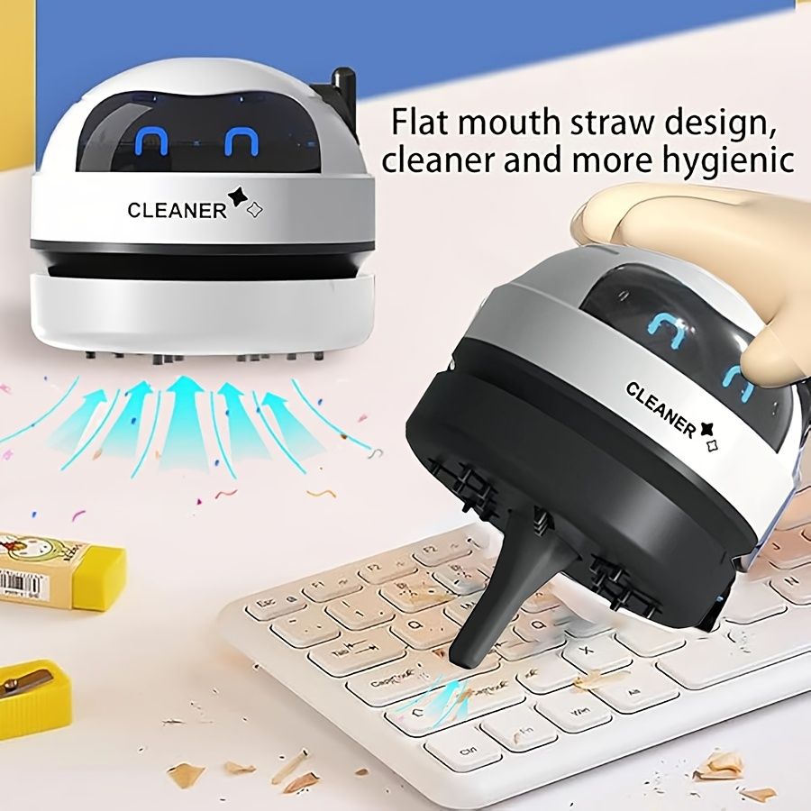 A Mini Desktop Vacuum Cleaner, Portable And Small, Powered by a Rechargeable USB Battery, Featuring a Cute Robot Design for Cleaning Desks Quietly, Picking Up Small Items Like Eraser Shavings And Debr