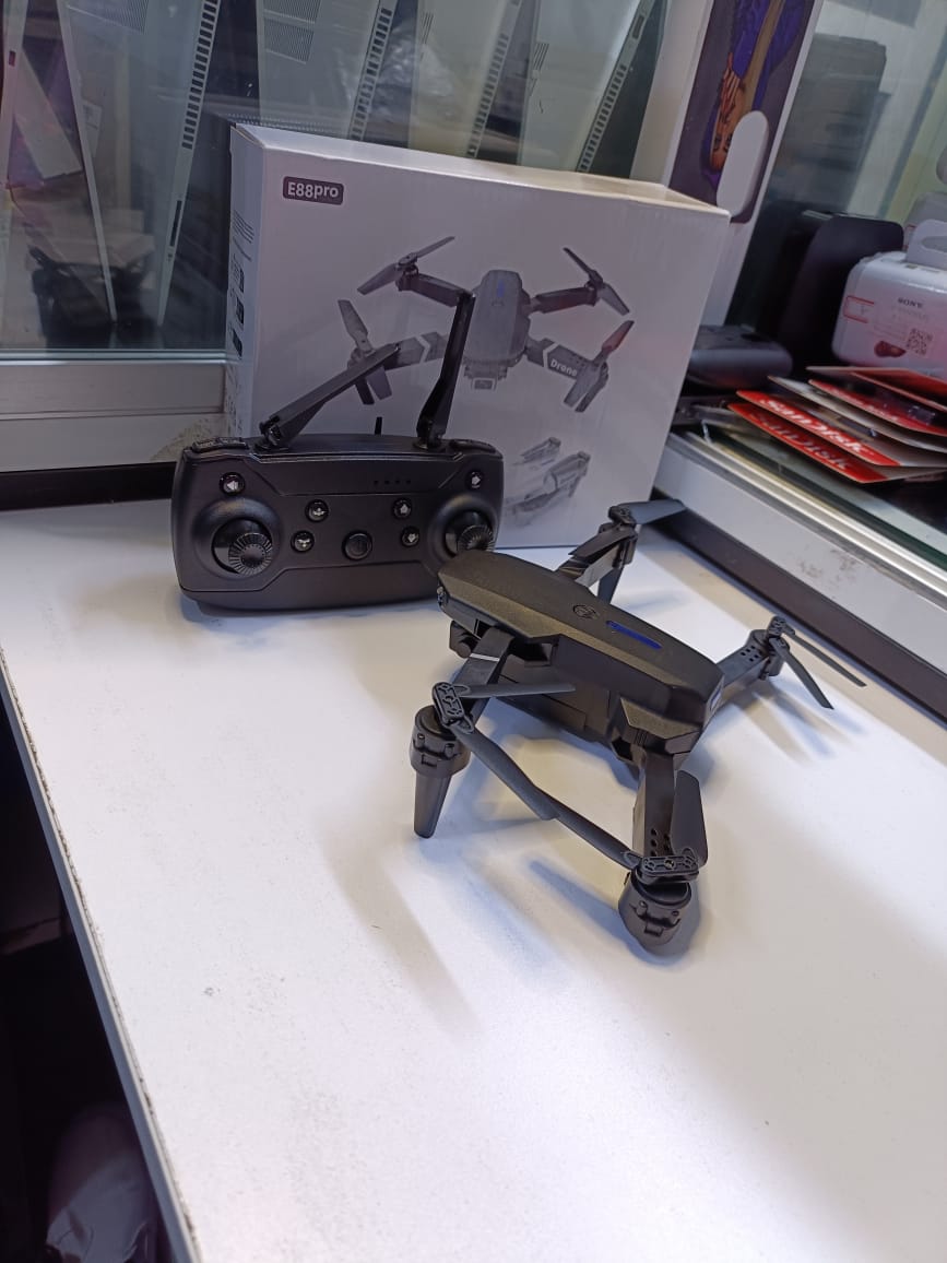 BRAND NEW  FOLDING DRONEUSER (E88PRO)High-Performance Drone Featuring Dual 4K Cameras with Superior Clarity, 4-Axis Stabilization for Smooth Flight, 15 Minutes of Battery Life for Extended Exp