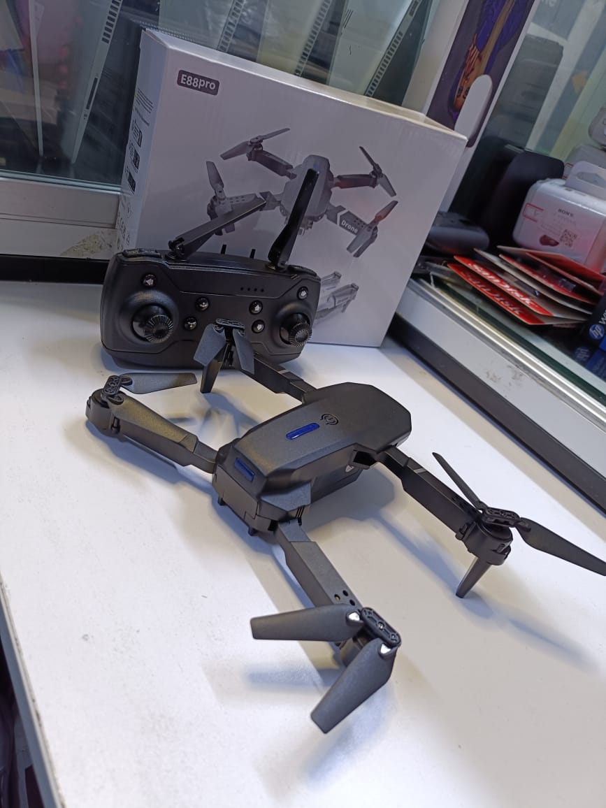 BRAND NEW  FOLDING DRONEUSER (E88PRO)High-Performance Drone Featuring Dual 4K Cameras with Superior Clarity, 4-Axis Stabilization for Smooth Flight, 15 Minutes of Battery Life for Extended Exp