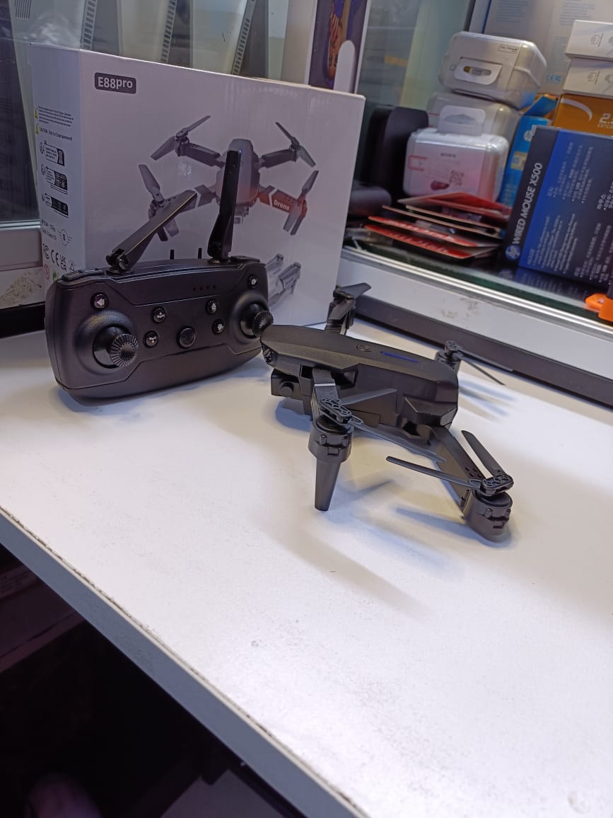 BRAND NEW  FOLDING DRONEUSER (E88PRO)High-Performance Drone Featuring Dual 4K Cameras with Superior Clarity, 4-Axis Stabilization for Smooth Flight, 15 Minutes of Battery Life for Extended Exp