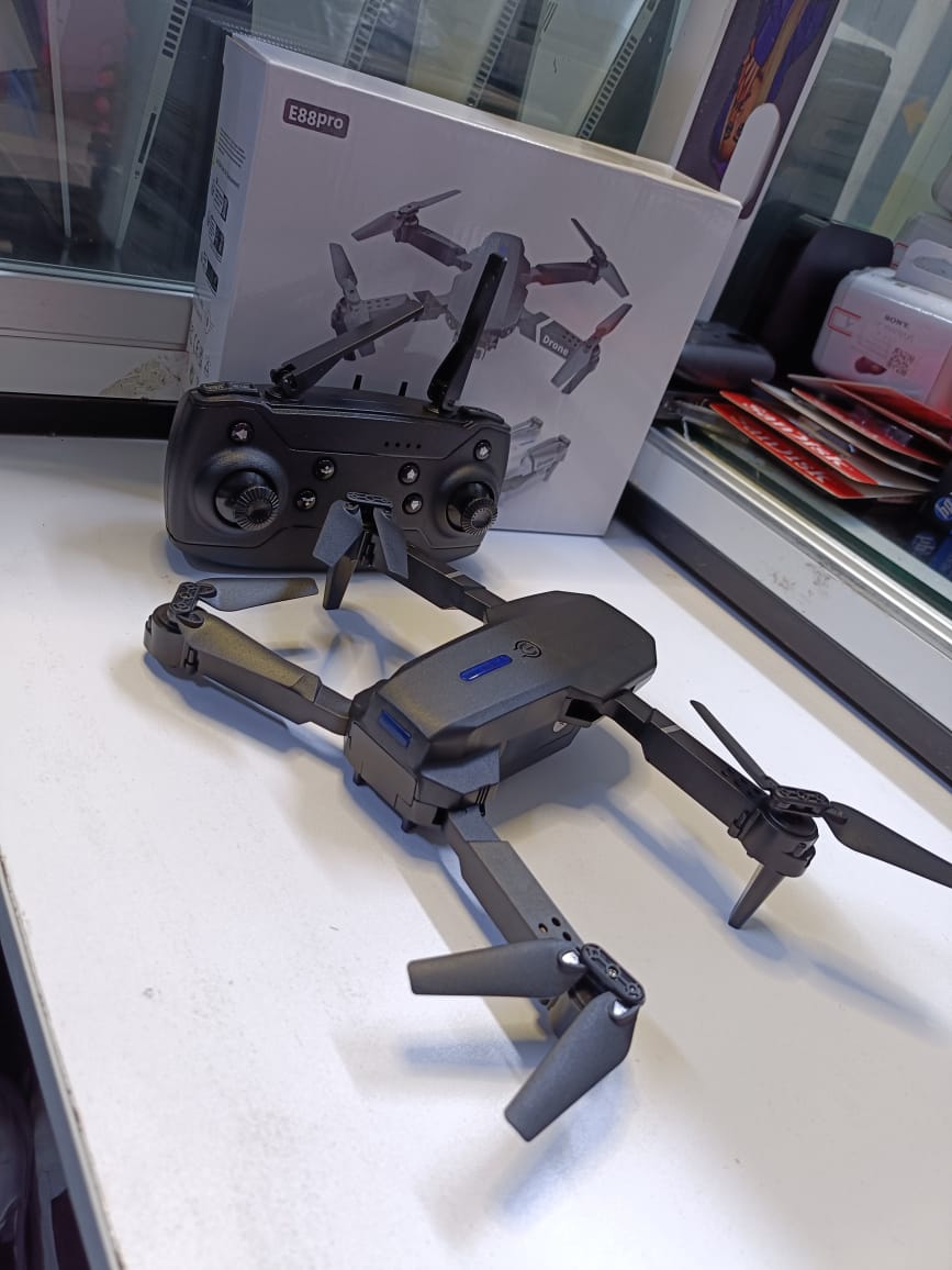 BRAND NEW  FOLDING DRONEUSER (E88PRO)High-Performance Drone Featuring Dual 4K Cameras with Superior Clarity, 4-Axis Stabilization for Smooth Flight, 15 Minutes of Battery Life for Extended Exp