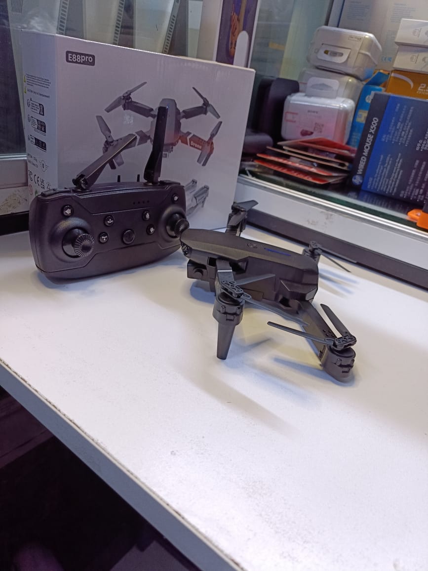 BRAND NEW  FOLDING DRONEUSER (E88PRO)High-Performance Drone Featuring Dual 4K Cameras with Superior Clarity, 4-Axis Stabilization for Smooth Flight, 15 Minutes of Battery Life for Extended Exp