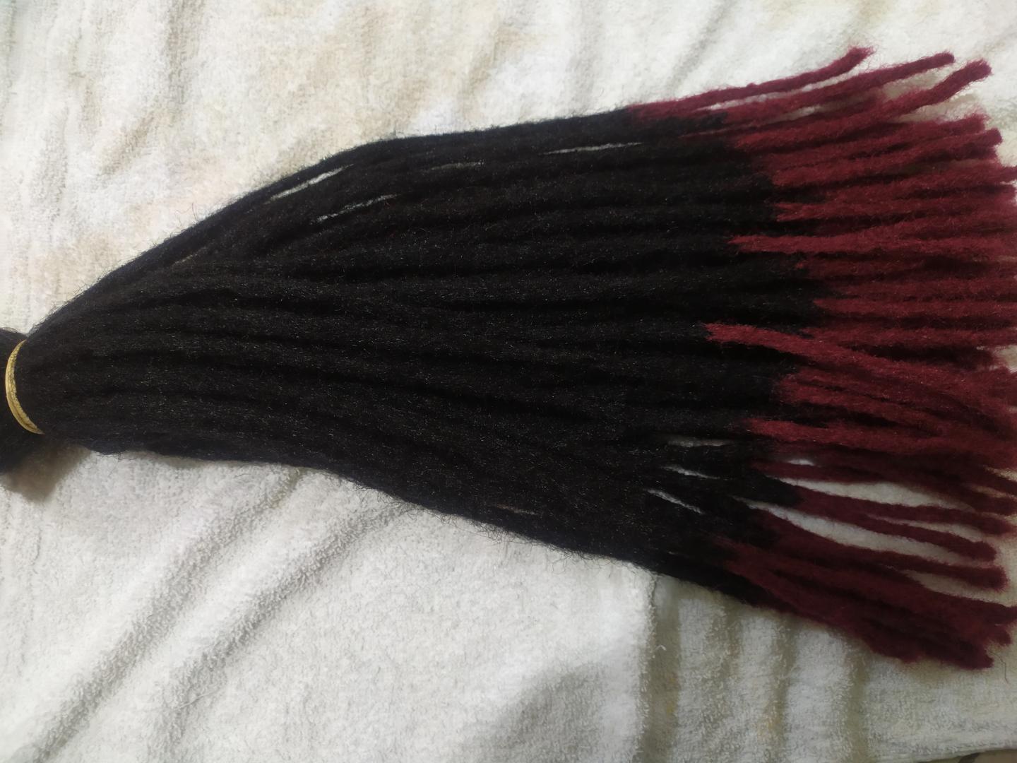 Artificial dreadlocks Dreadlock extensions are pre-made dreadlocks (or locs) that are added to your natural hair to achieve a desired length, volume, or look without having to wait for your hair to lo