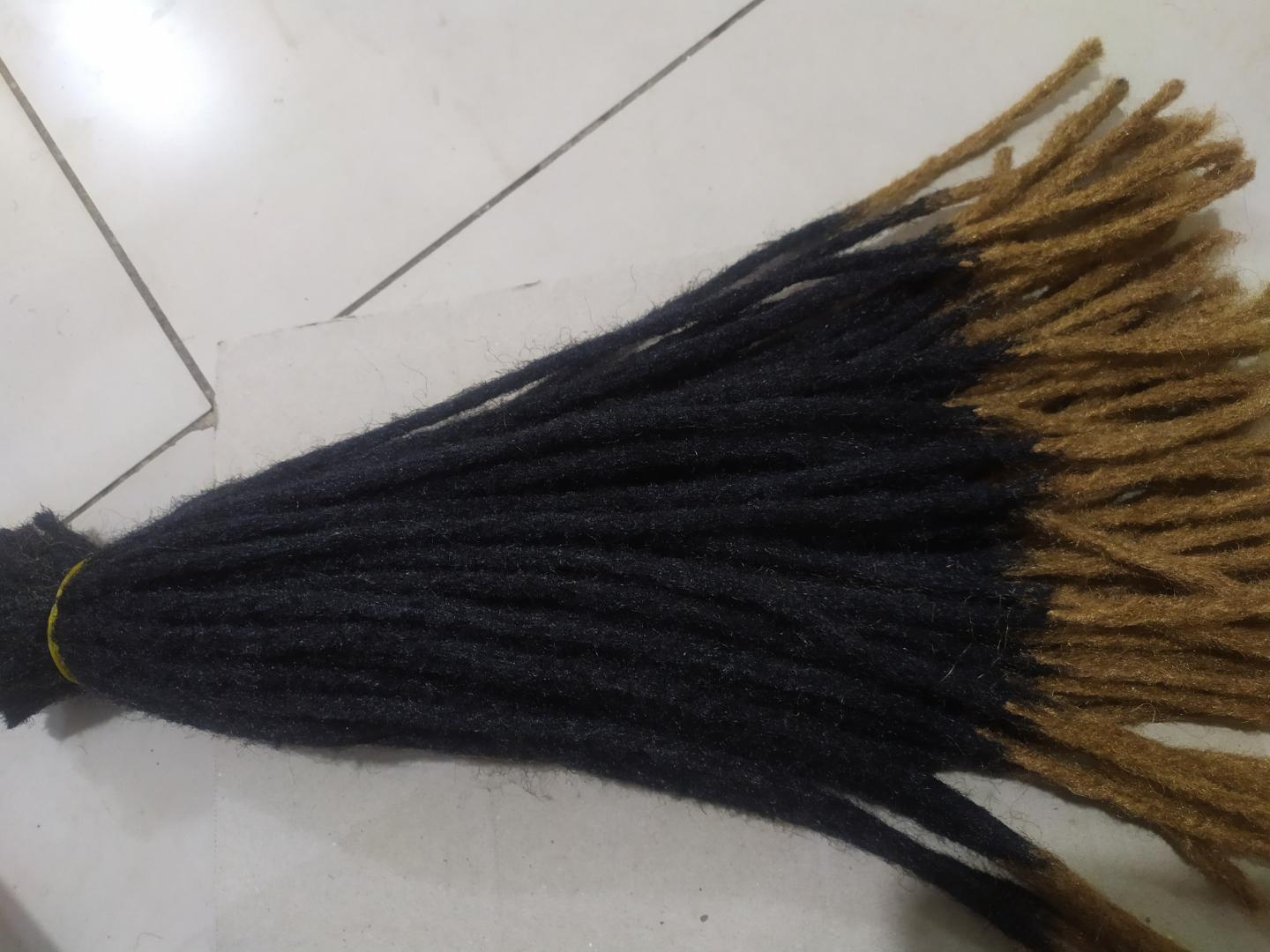 Synthetic Dreadlocks fall into the hair extensions category because the individual locs are attached to your natural hair. This can be accomplished by the extensions being braided or twisted in, from