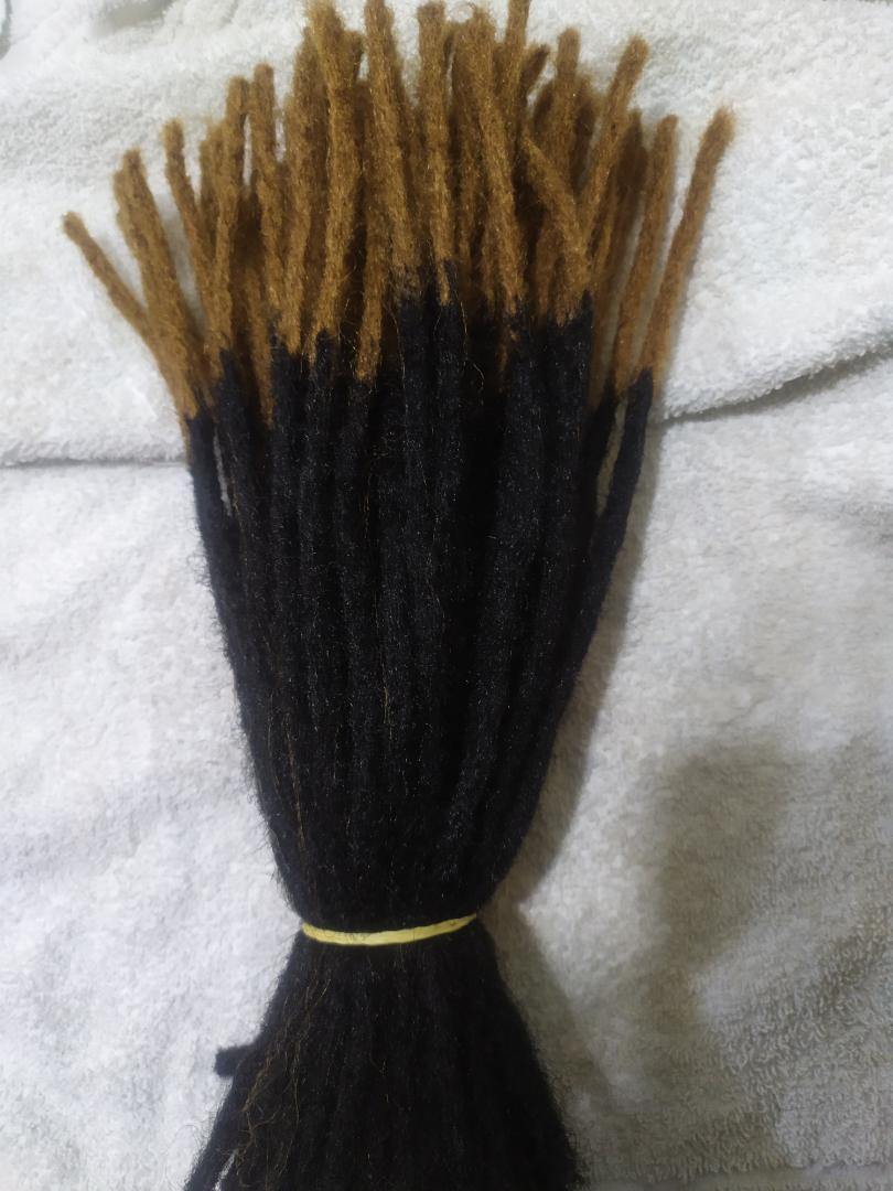 Artificial dreadlocks shoulder length Synthetic Dreadlocks fall into the hair extensions category because the individual locs are attached to your natural hair. This can be accomplished by the extensi