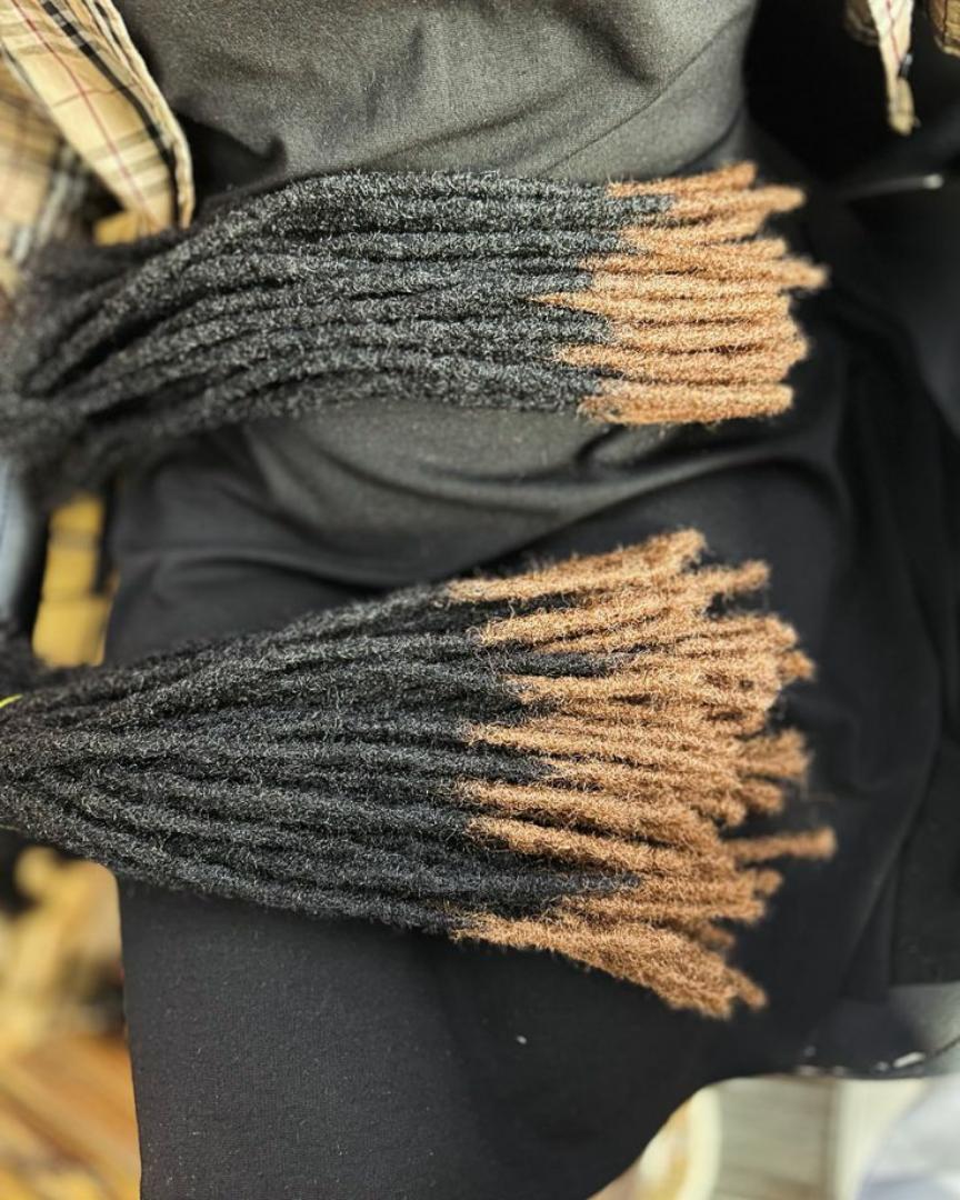 artificial dreadlocks Synthetic Dreadlocks fall into the hair extensions category because the individual locs are attached to your natural hair. This can be accomplished by the extensions being Very s