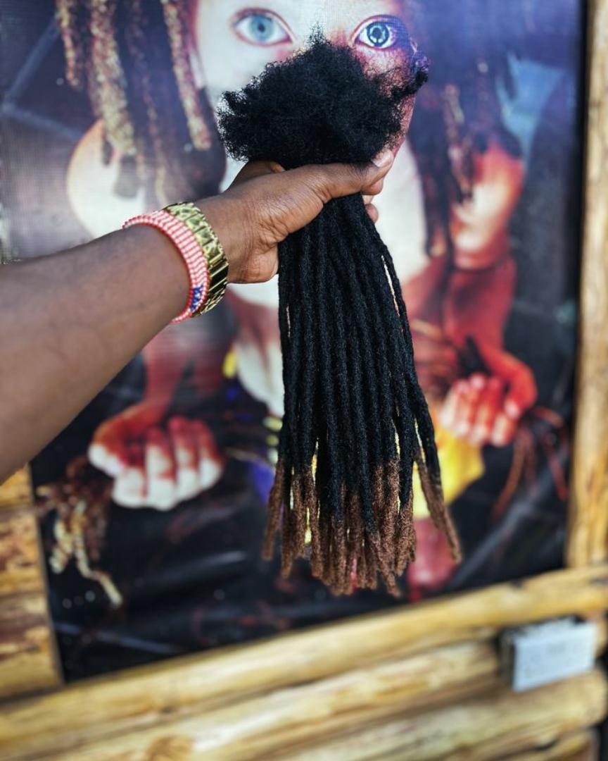 artificial dreadlocks Synthetic Dreadlocks fall into the hair extensions category because the individual locs are attached to your natural hair. This can be accomplished by the extensions being Very s
