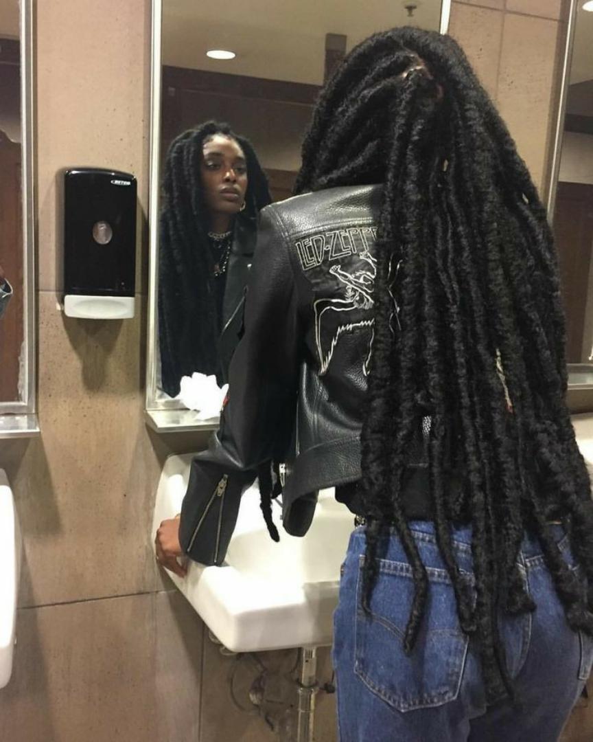 Riri locs are a bold variation of faux locs, known for their thicker, chunkier appearance. This style exudes confidence and a carefree flair, often featuring a slightly undone, textured finish. These