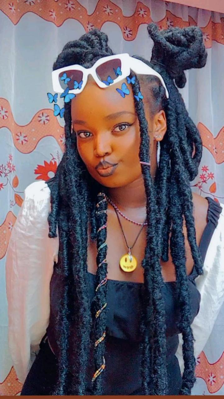 Riri locs are a bold variation of faux locs, known for their thicker, chunkier appearance. This style exudes confidence and a carefree flair, often featuring a slightly undone, textured finish. These