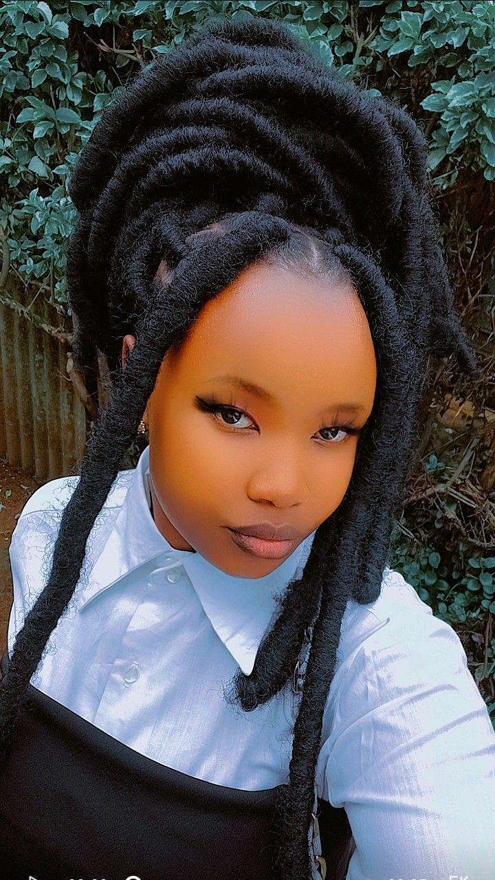 Riri locs are a bold variation of faux locs, known for their thicker, chunkier appearance. This style exudes confidence and a carefree flair, often featuring a slightly undone, textured finish. These